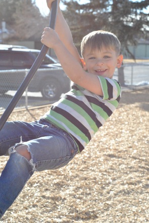 kid swinging 